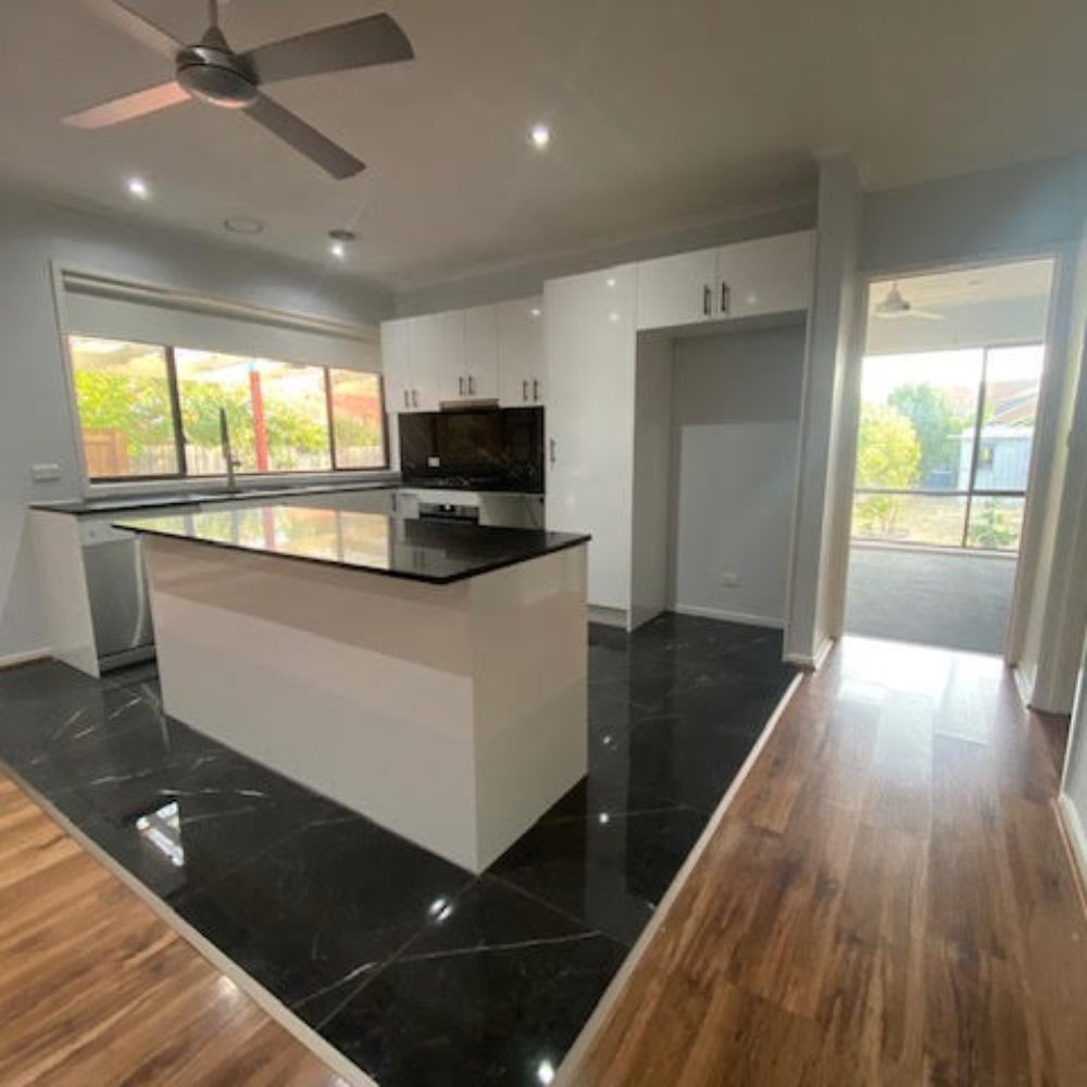 A renovated kitchen with modern cabinetry and appliances