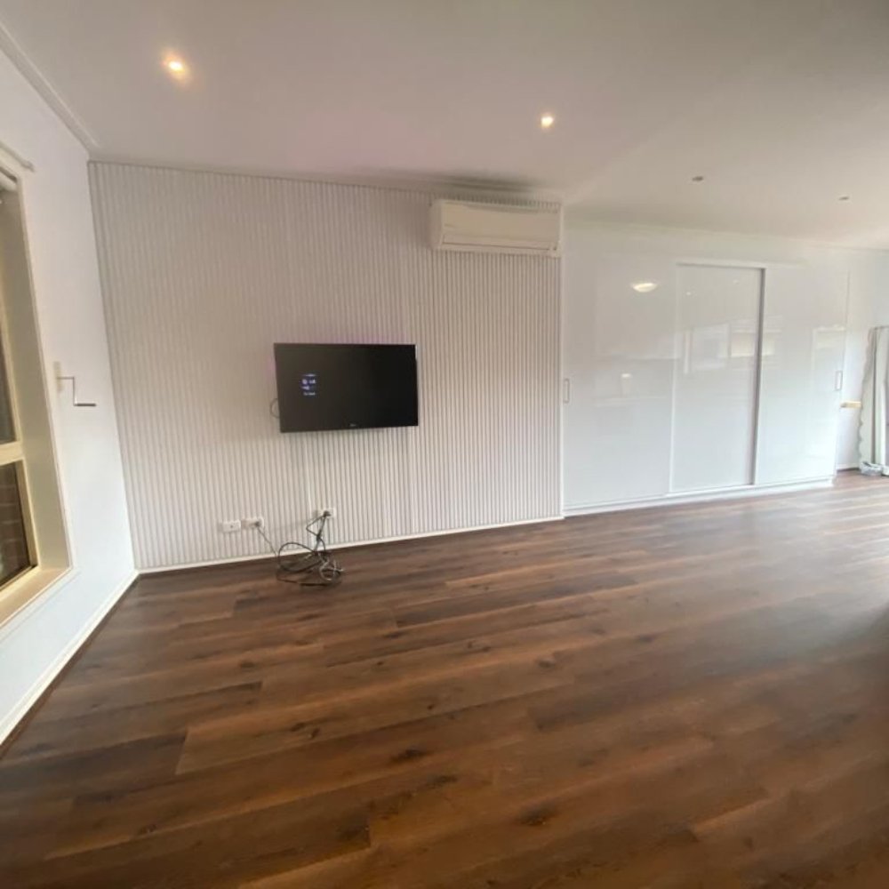 Bright and modern living space with fresh paint and stylish furnishings after renovation