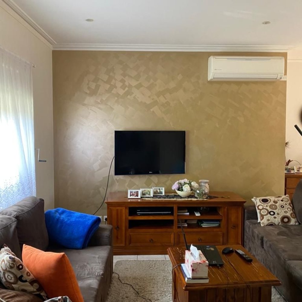 House in need of renovation with faded surfaces and damaged features