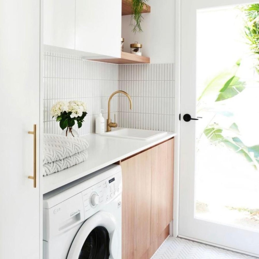 Upgraded laundry room with modern appliance