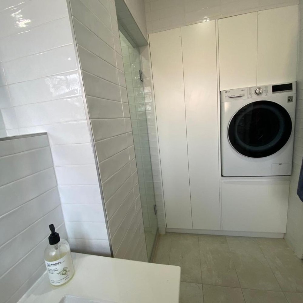 Renovated laundry room with ample storage
