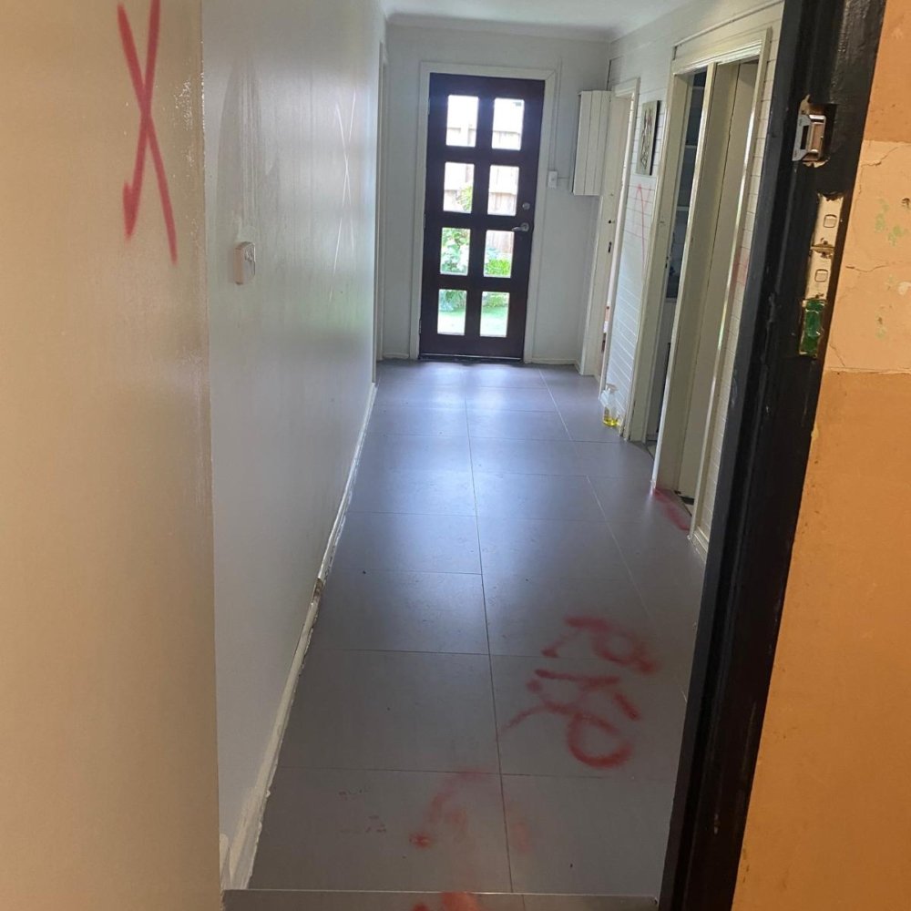 House before renovation with old paint, damaged walls