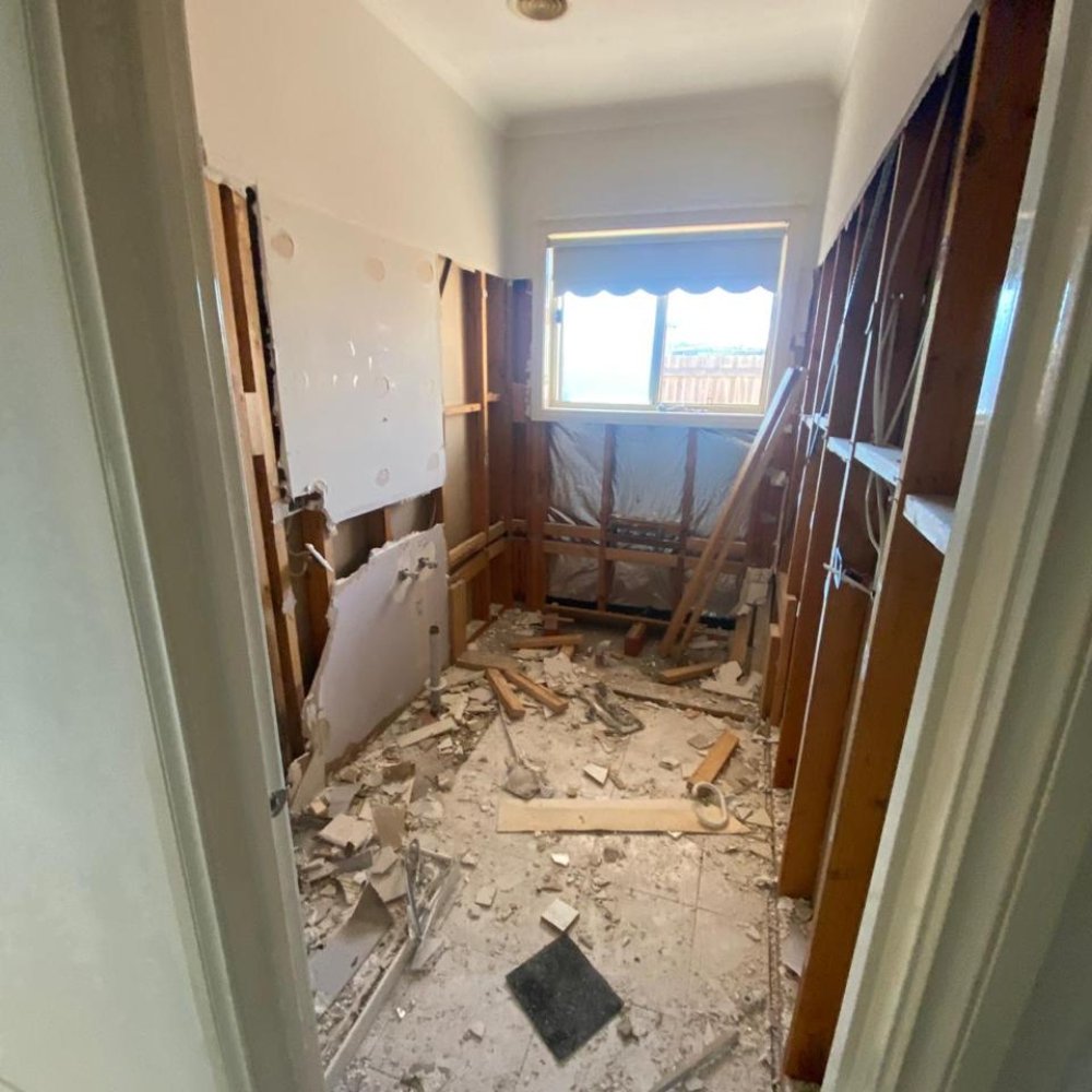 Room with outdated decor and worn surfaces