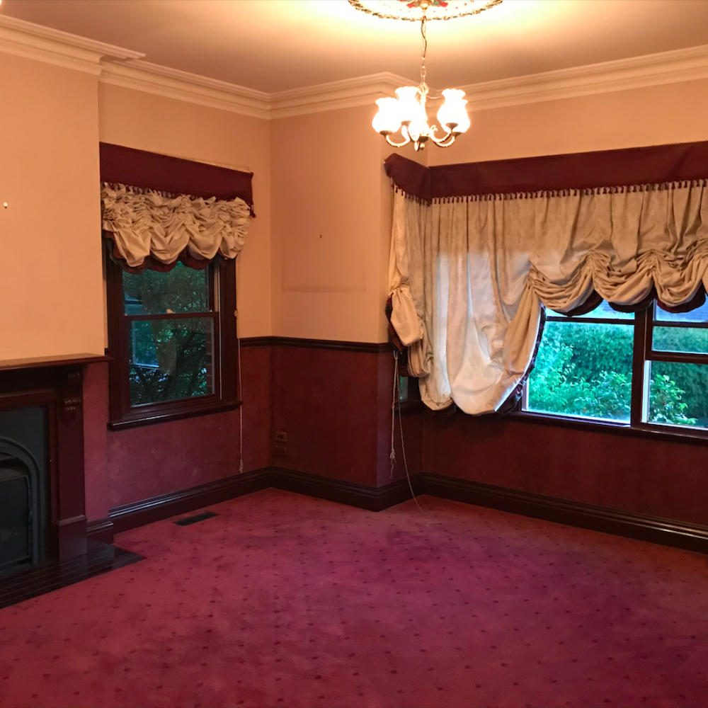 Before image of a room in need of renovation with outdated decor